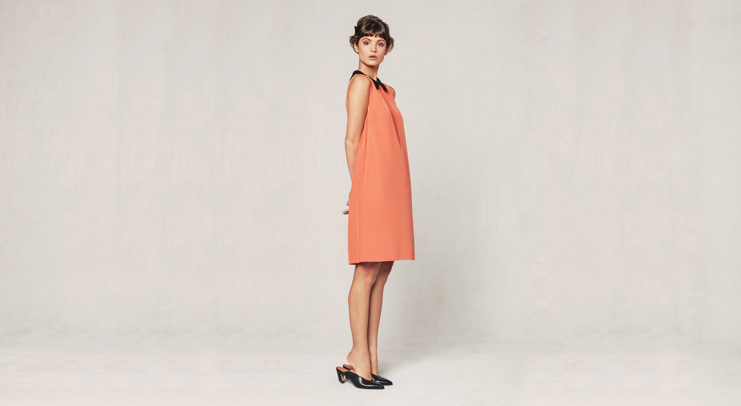 Model in orange dress