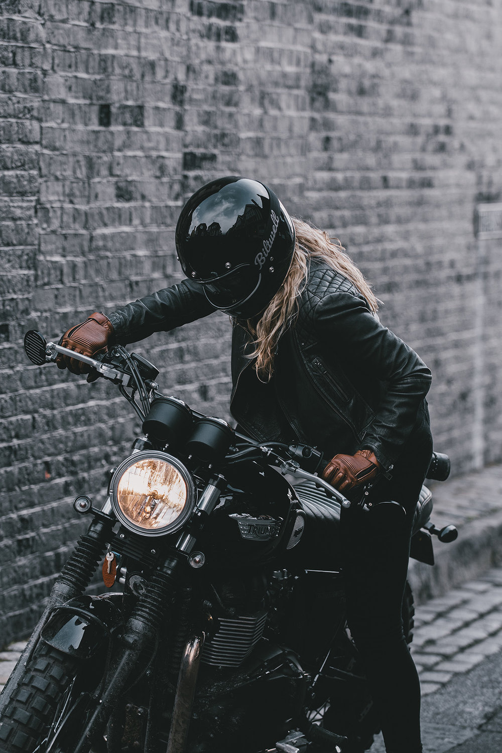 Girl stepping on bike